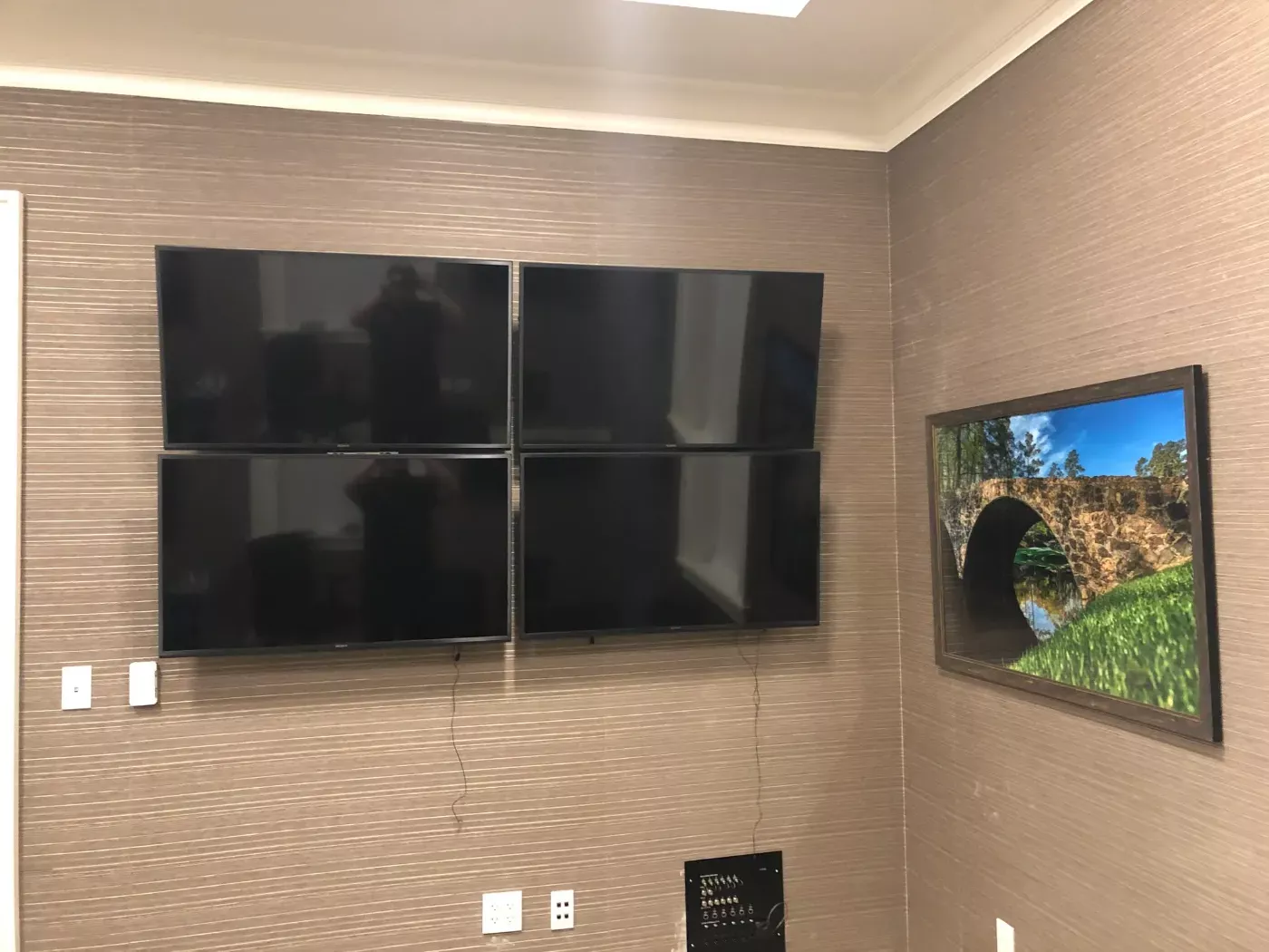 Four-screen video wall for a business by Home Tech Solutions