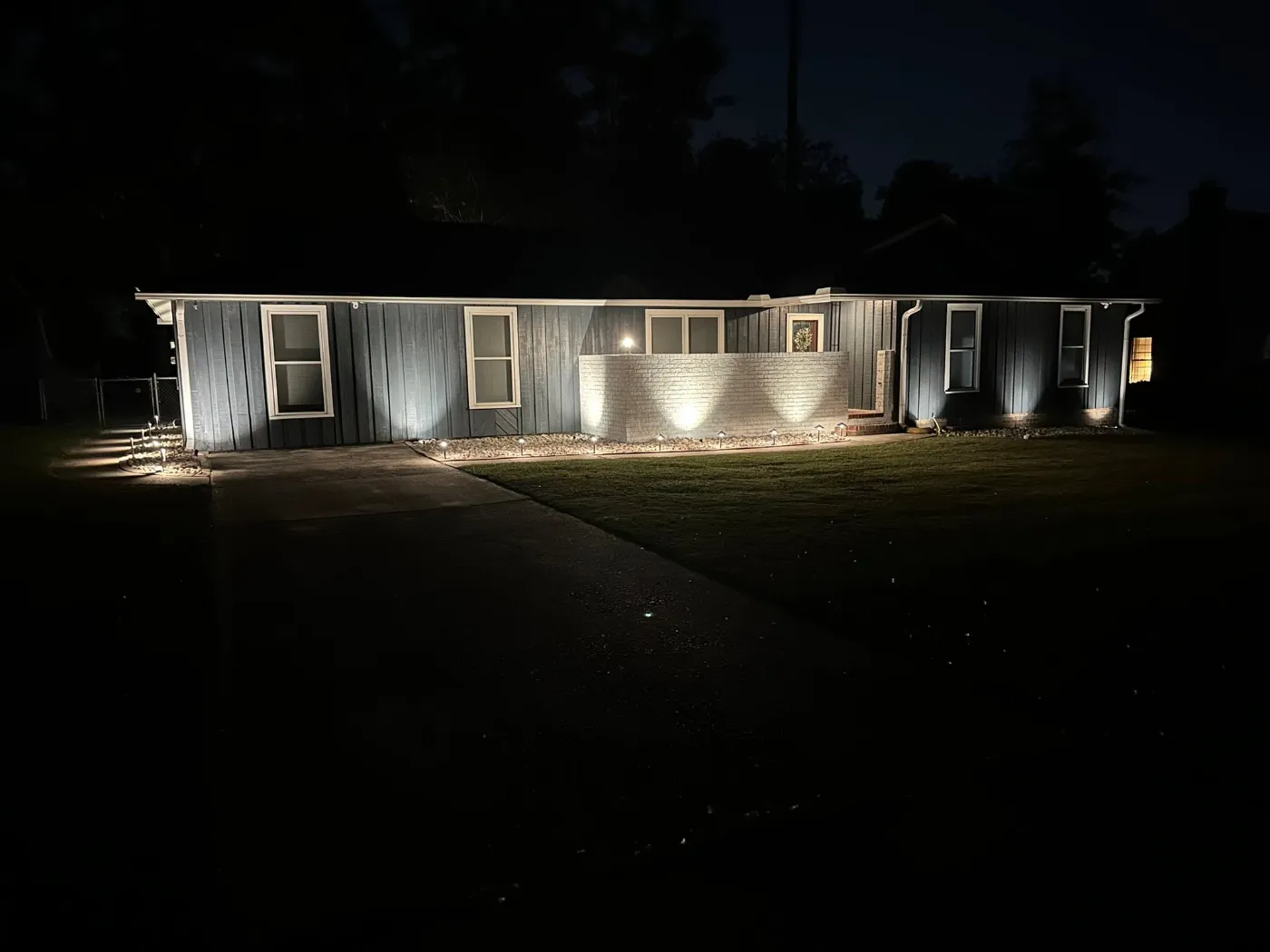 Landscape lighting that makes the home glow by Home Tech Solutions