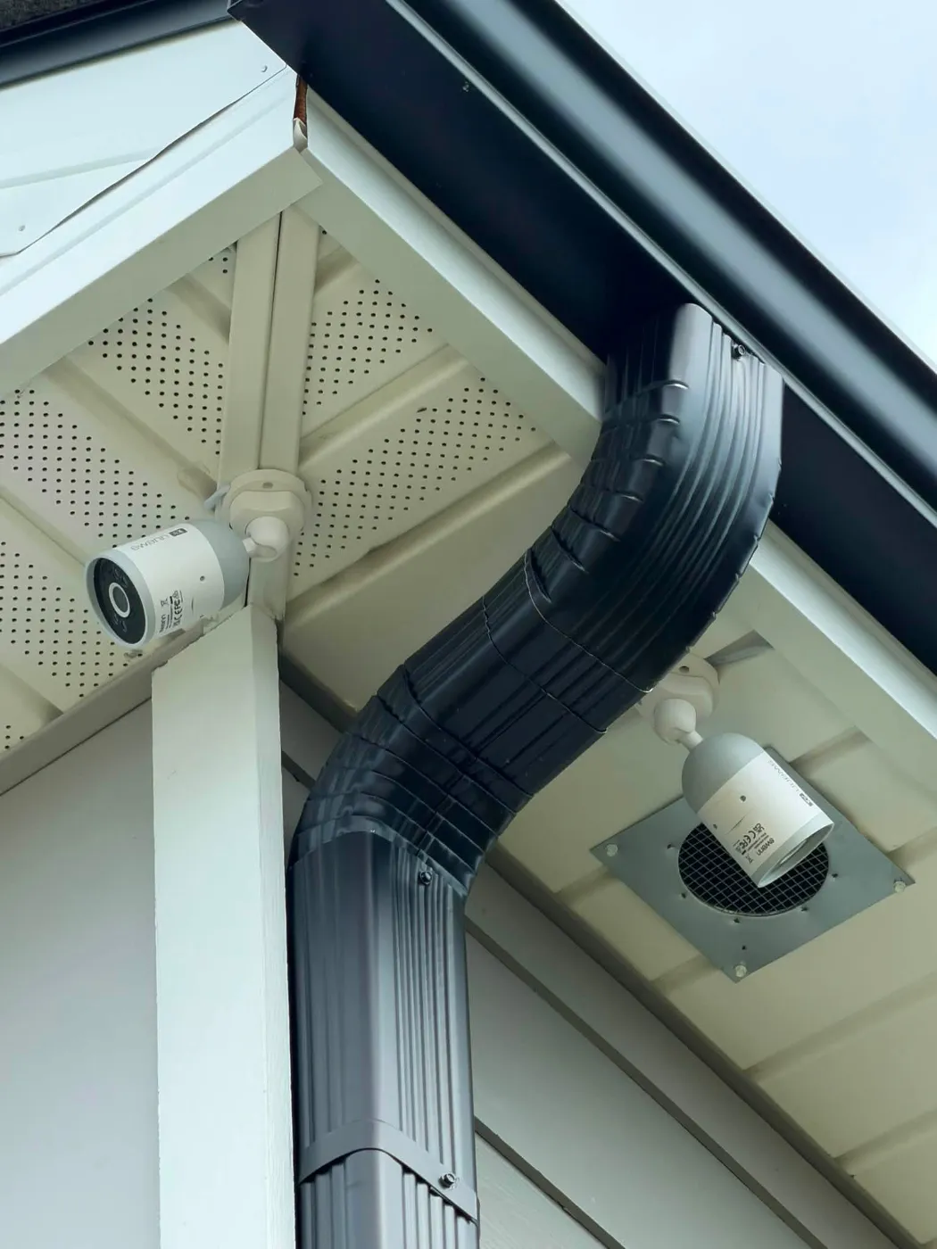 Security camera mounted clean under the eaves by Home Tech Solutions